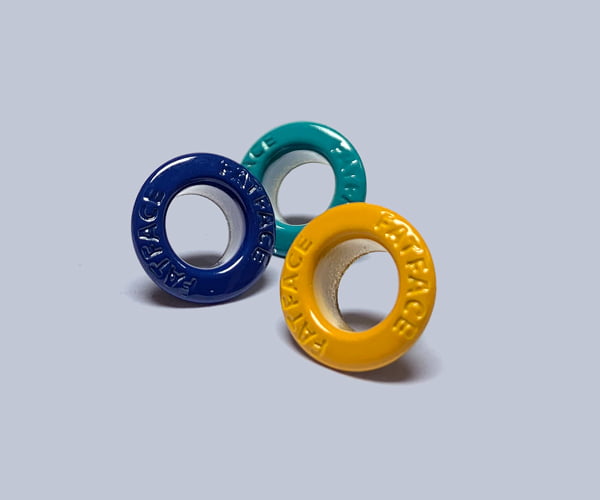 Metal eyelets for branding outerwear garments.