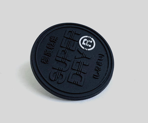 Rubber labels for branding apparel.