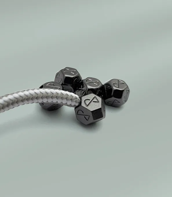 Custom cord ends and toggles for clothing.