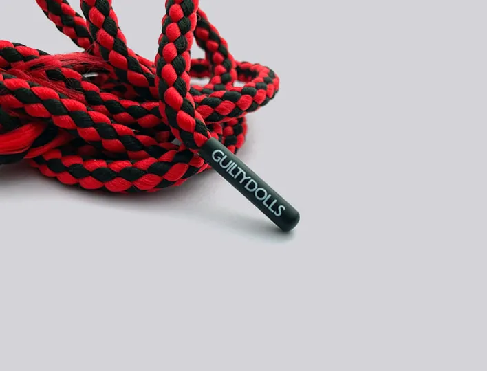 Metal cord end with printed logo.