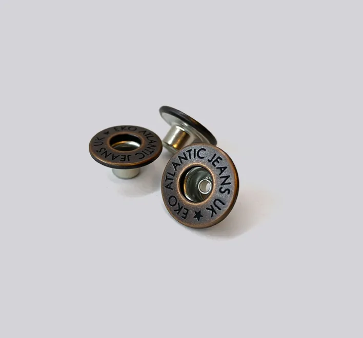 Open top brass jeans button engraved.