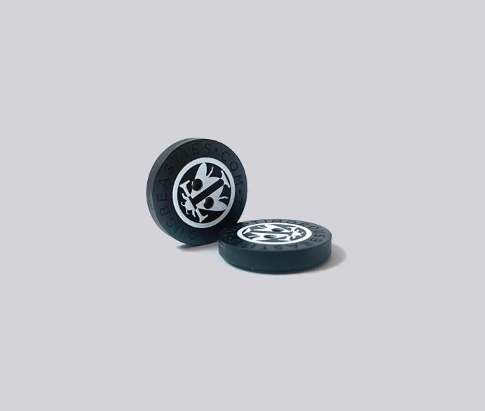 Plastic sew-on button with printed design.