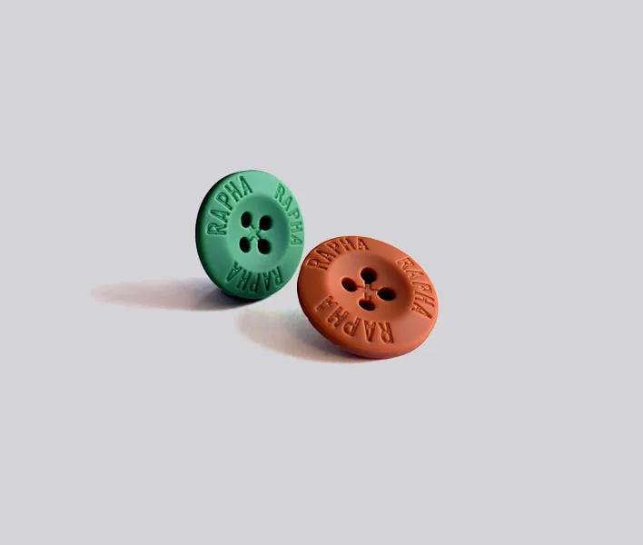 Plastic 4-hole engraved sew-on button.