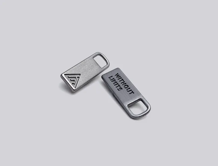 Engraved metal zipper pulls